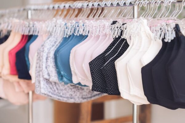 bras hanging on a rail